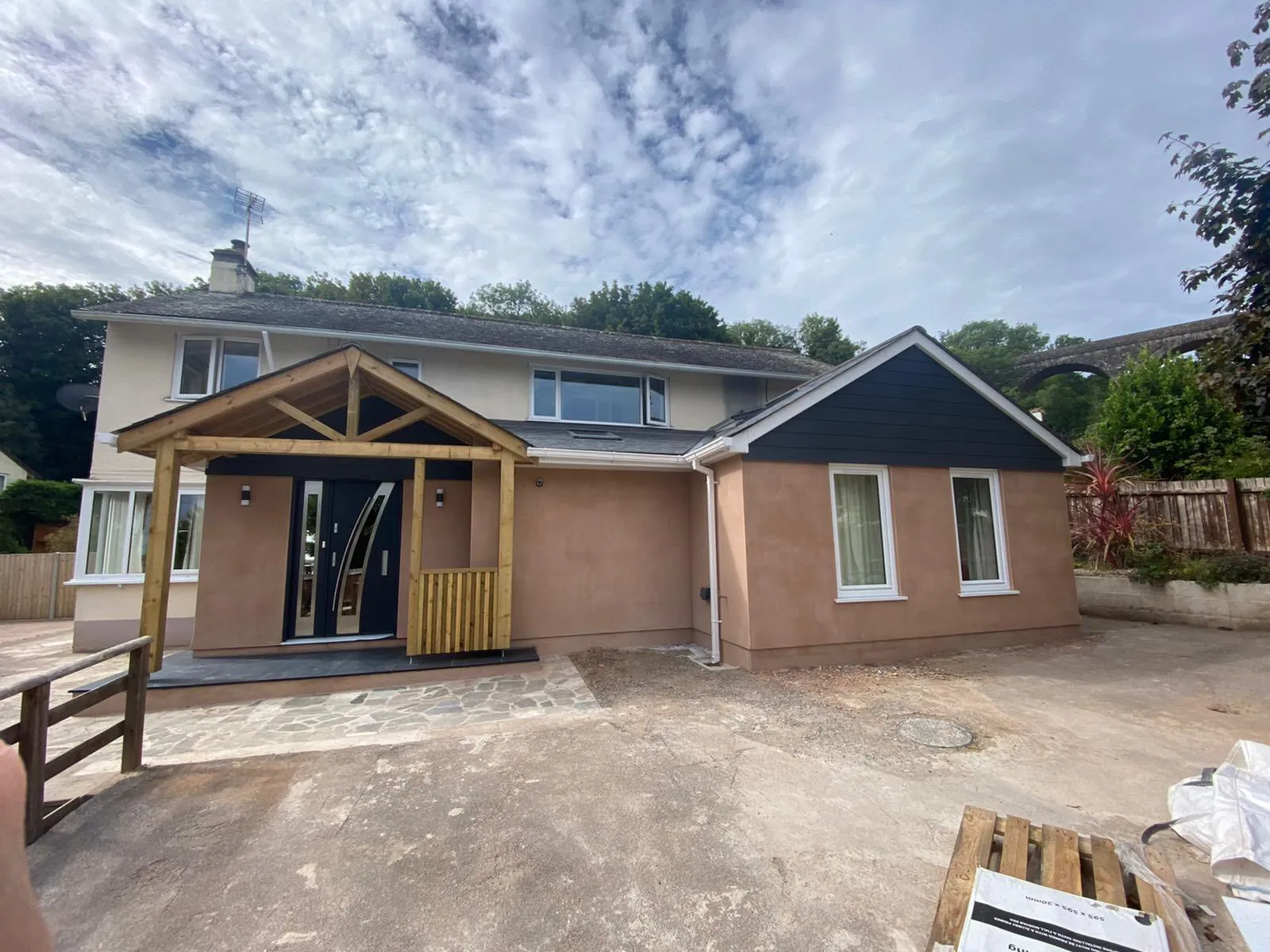 A house being built with a wooden deck.